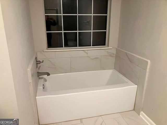 bathroom with a tub