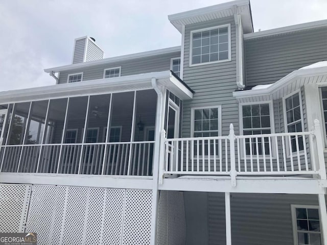 rear view of house with a sunroom