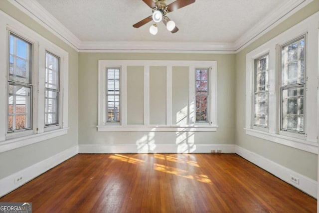 unfurnished sunroom featuring a ceiling fan