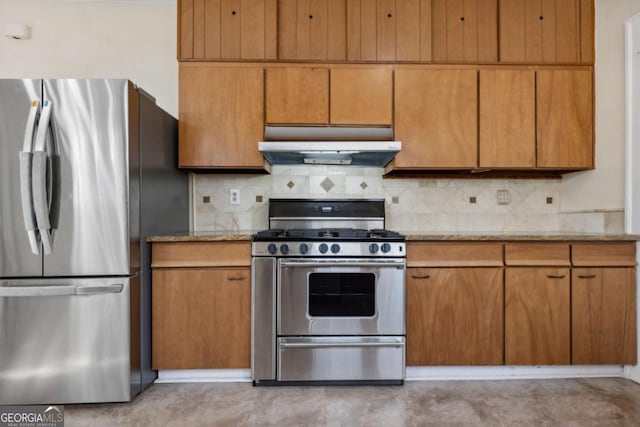 kitchen featuring backsplash, light stone countertops, under cabinet range hood, concrete flooring, and stainless steel appliances