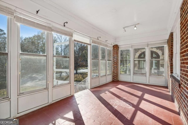 1366 Emory Rd NE, Atlanta, GA 30306 - unfurnished sunroom featuring rail lighting and a wealth of natural light