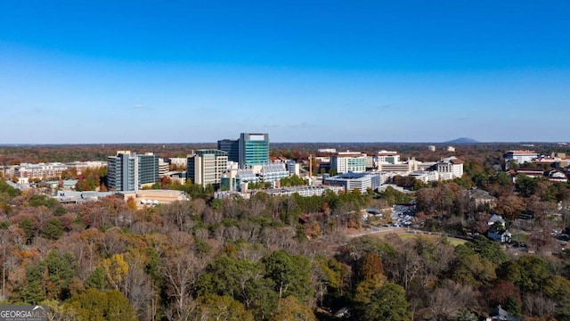 birds eye view of property with a view of city