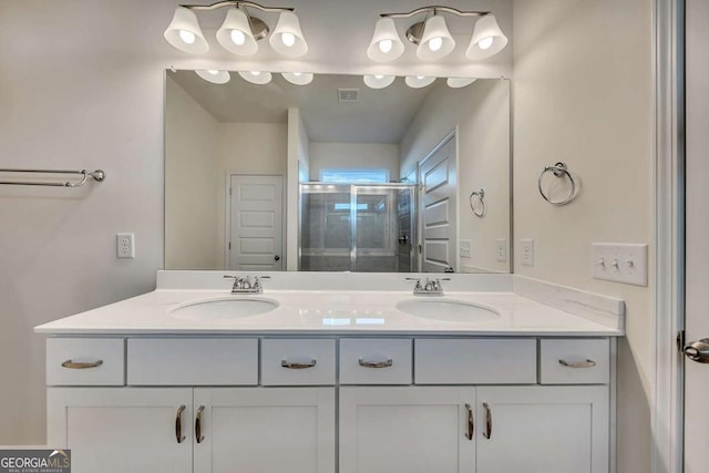 bathroom with an enclosed shower and vanity