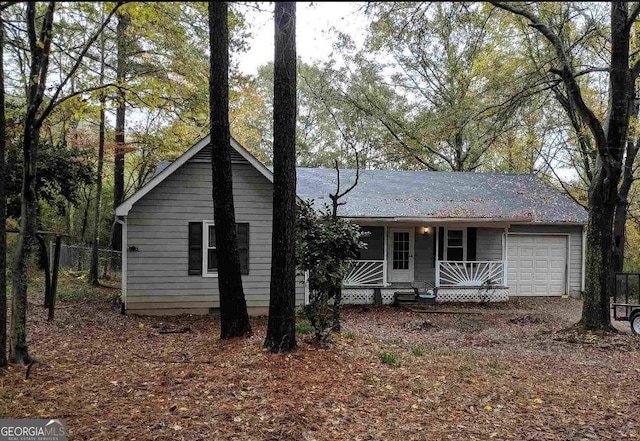 single story home with a garage and covered porch