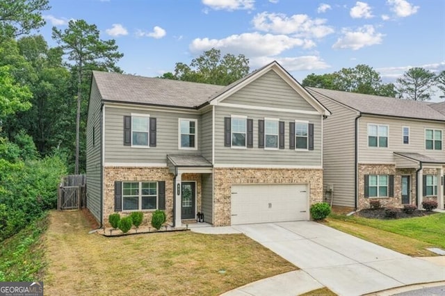 view of front of house with a garage and a front yard