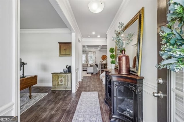 foyer entrance featuring dark hardwood / wood-style flooring and ornamental molding