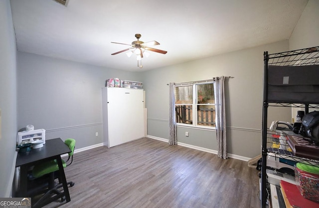 miscellaneous room with ceiling fan and hardwood / wood-style floors