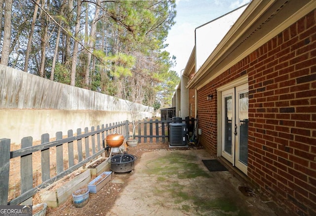 view of patio / terrace with french doors and cooling unit