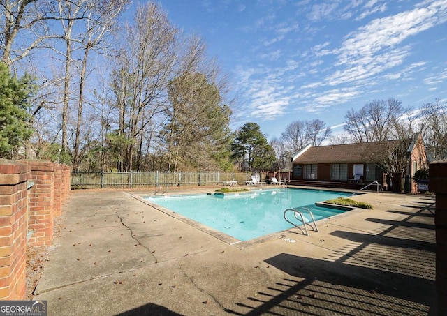 view of pool featuring a patio