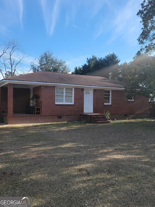 ranch-style home with a front yard