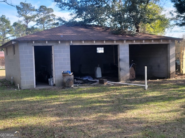 garage featuring a yard