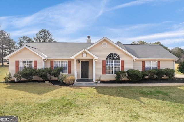 ranch-style house with a front yard