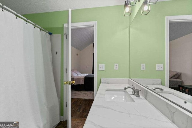 bathroom featuring vanity and a textured ceiling