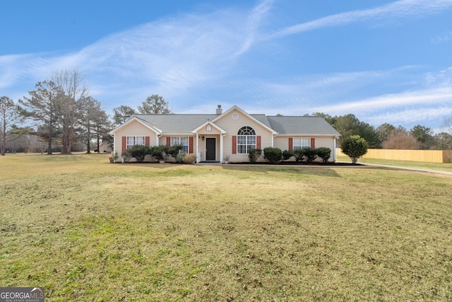 ranch-style home featuring a front lawn