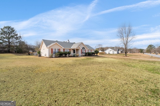 ranch-style house with a porch and a front yard