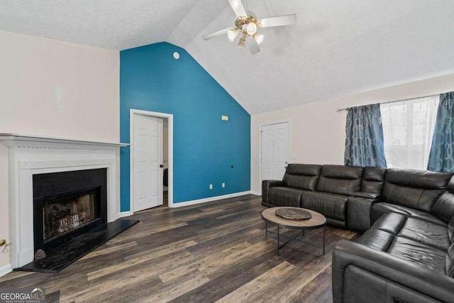 living room featuring ceiling fan, vaulted ceiling, and dark hardwood / wood-style floors