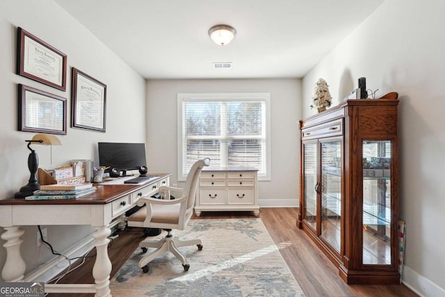 office space featuring light hardwood / wood-style floors