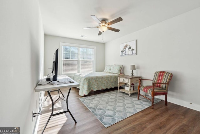 bedroom with hardwood / wood-style flooring and ceiling fan