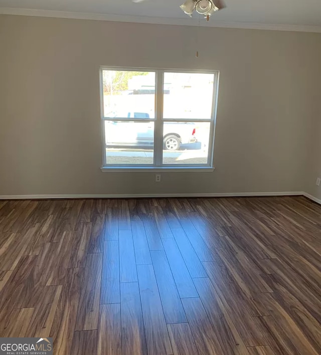 unfurnished room with ceiling fan, dark hardwood / wood-style floors, and ornamental molding