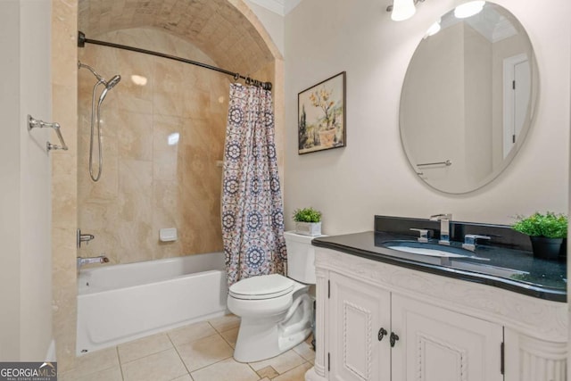 full bathroom featuring tile patterned flooring, vanity, toilet, and shower / bath combo with shower curtain