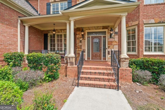 entrance to property featuring covered porch