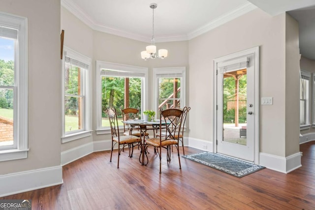 dining area featuring ornamental molding and a healthy amount of sunlight