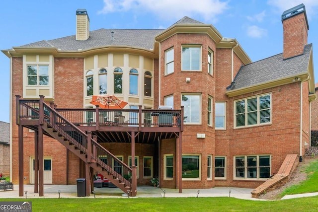 back of house featuring a deck