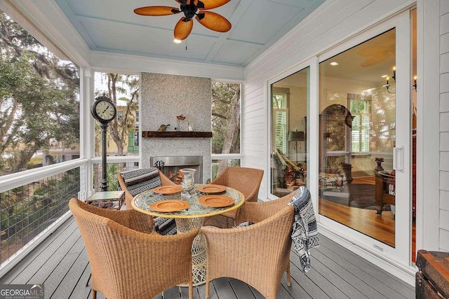 sunroom / solarium with ceiling fan