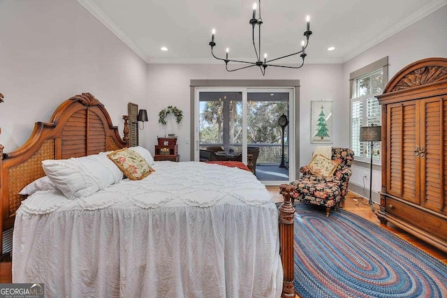 bedroom featuring hardwood / wood-style flooring, a notable chandelier, ornamental molding, and access to outside