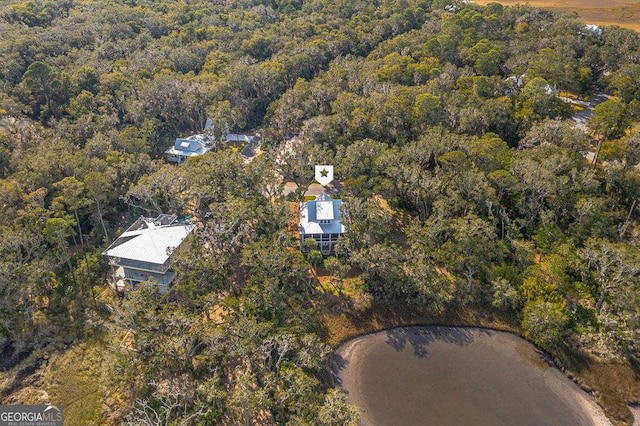 drone / aerial view featuring a view of trees