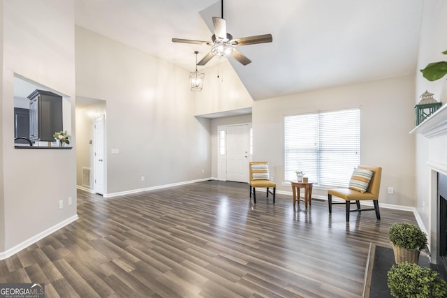 sitting room with high vaulted ceiling, ceiling fan, and dark hardwood / wood-style floors