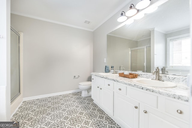 bathroom with an enclosed shower, vanity, and crown molding