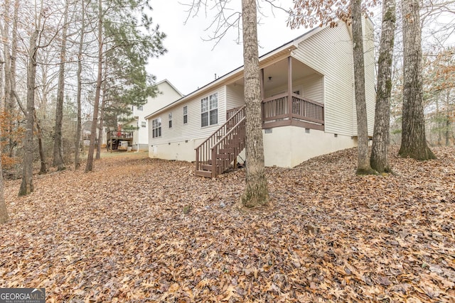 view of side of home with a balcony