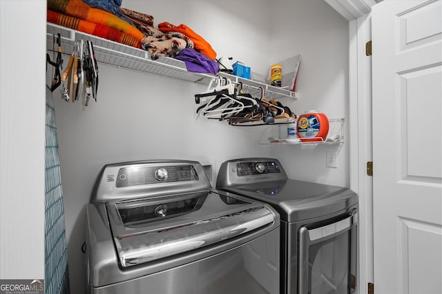 clothes washing area featuring washer and dryer