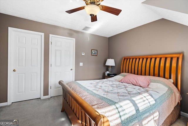 carpeted bedroom with lofted ceiling and ceiling fan