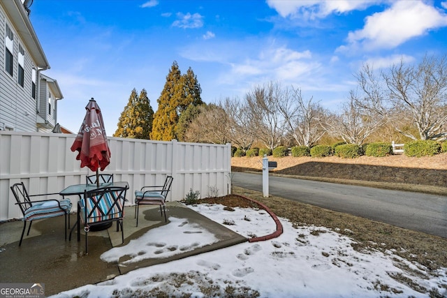 view of snow covered patio