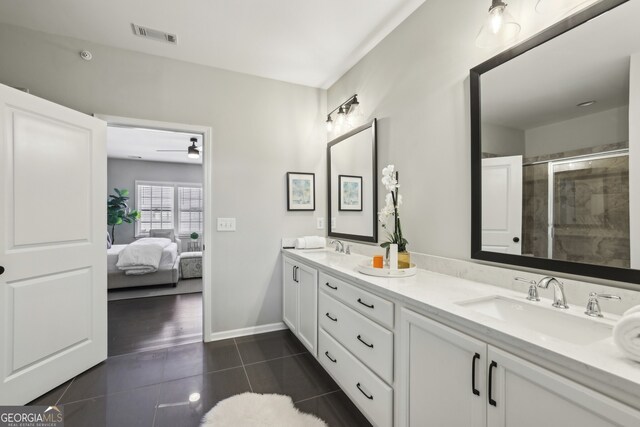 bathroom with walk in shower and tile patterned floors