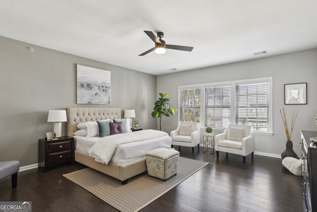 bedroom featuring ceiling fan and dark hardwood / wood-style flooring