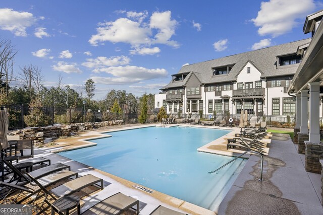 view of swimming pool with a patio area