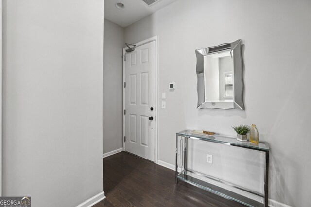 corridor featuring dark hardwood / wood-style floors