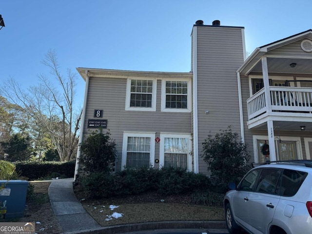 view of front of property with a balcony