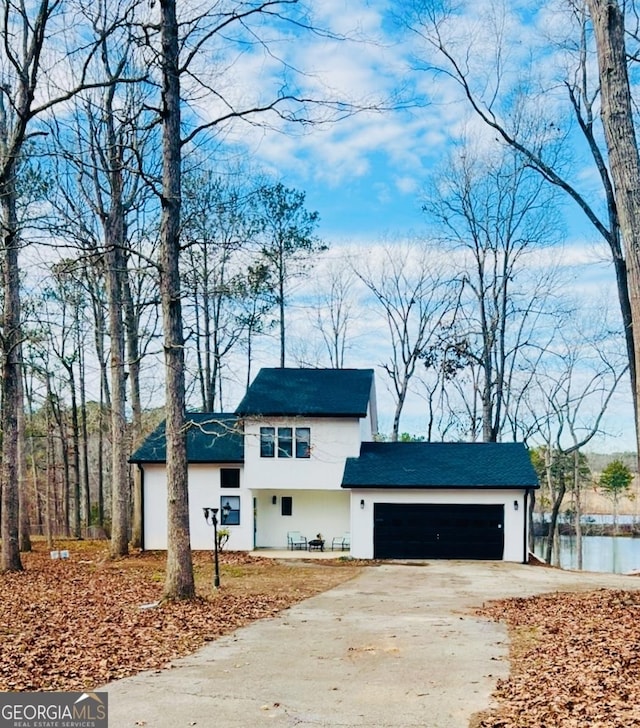 148 N Stewart Ln, Griffin, GA 30224 - view of front of property featuring concrete driveway, an attached garage, and stucco siding