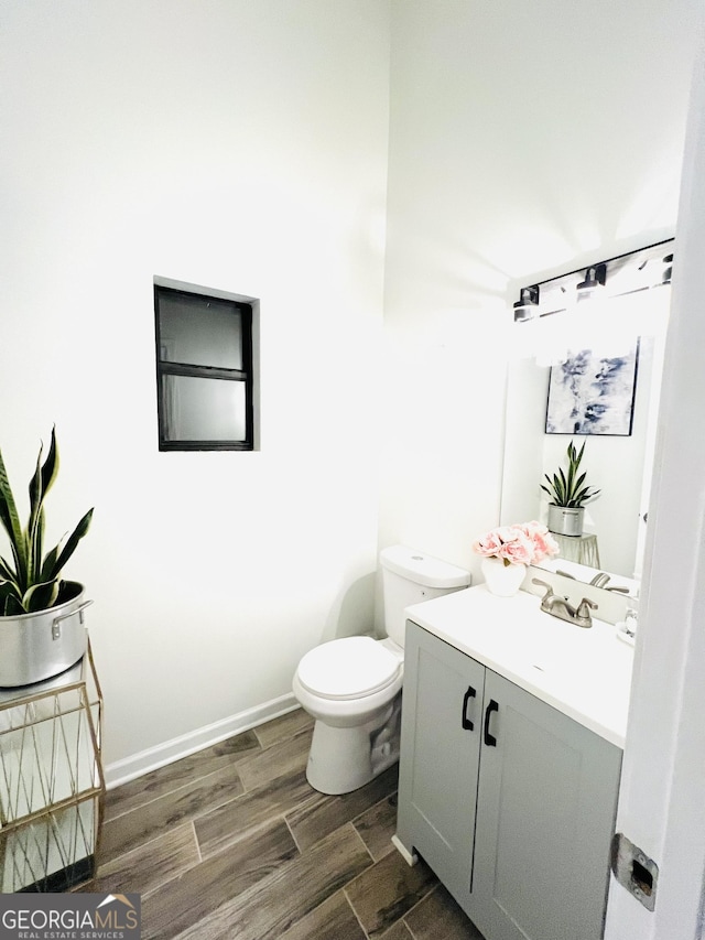 bathroom with toilet and vanity