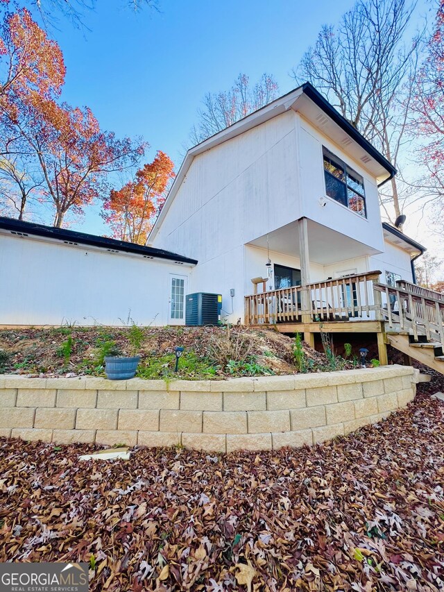 148 N Stewart Ln, Griffin, GA 30224 - rear view of house featuring a deck and central AC unit