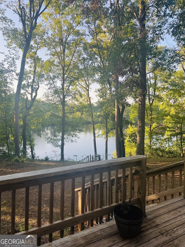 deck featuring a water view