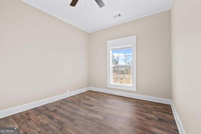 spare room featuring ornamental molding, ceiling fan, and dark hardwood / wood-style flooring