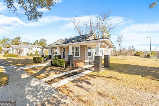 view of front of home featuring a porch and a front lawn