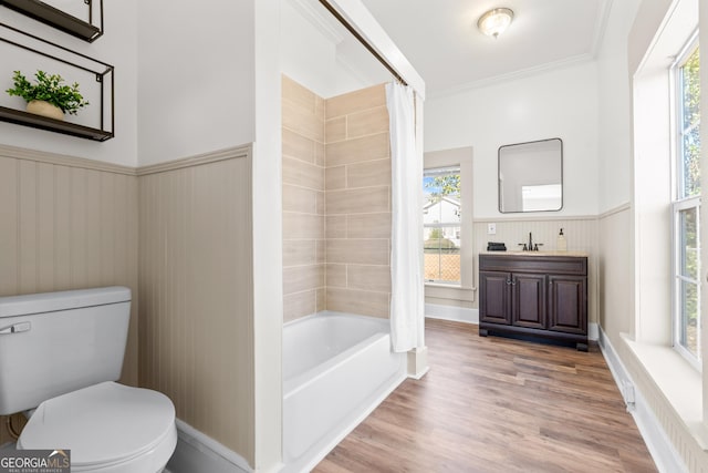 full bathroom featuring toilet, shower / bath combination with curtain, wood-type flooring, and plenty of natural light