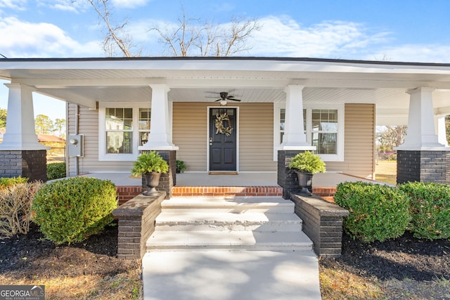 entrance to property featuring ceiling fan and covered porch