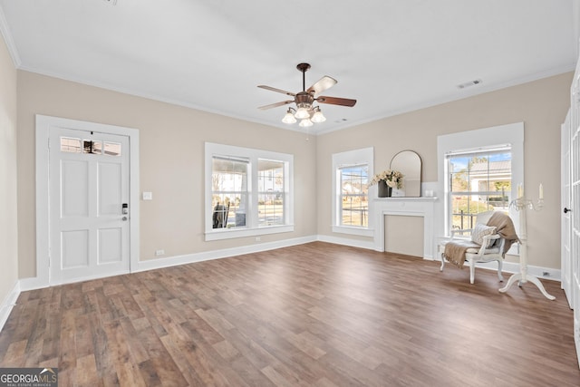 unfurnished living room with ceiling fan, crown molding, and hardwood / wood-style floors